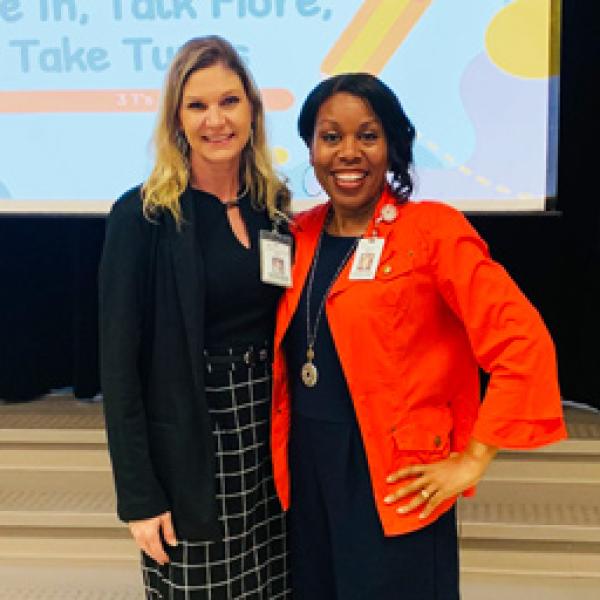 Early Childhood Coordinator, Chasity Bass, giving a presentation with another department staff member.