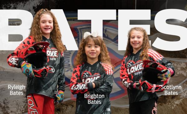 Bates Sisters stand in their BMX racing uniforms