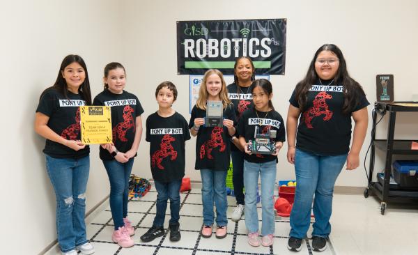 Pearson Robotics Team stands with their robots