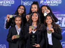 Award-winning HOSA team holding up medals