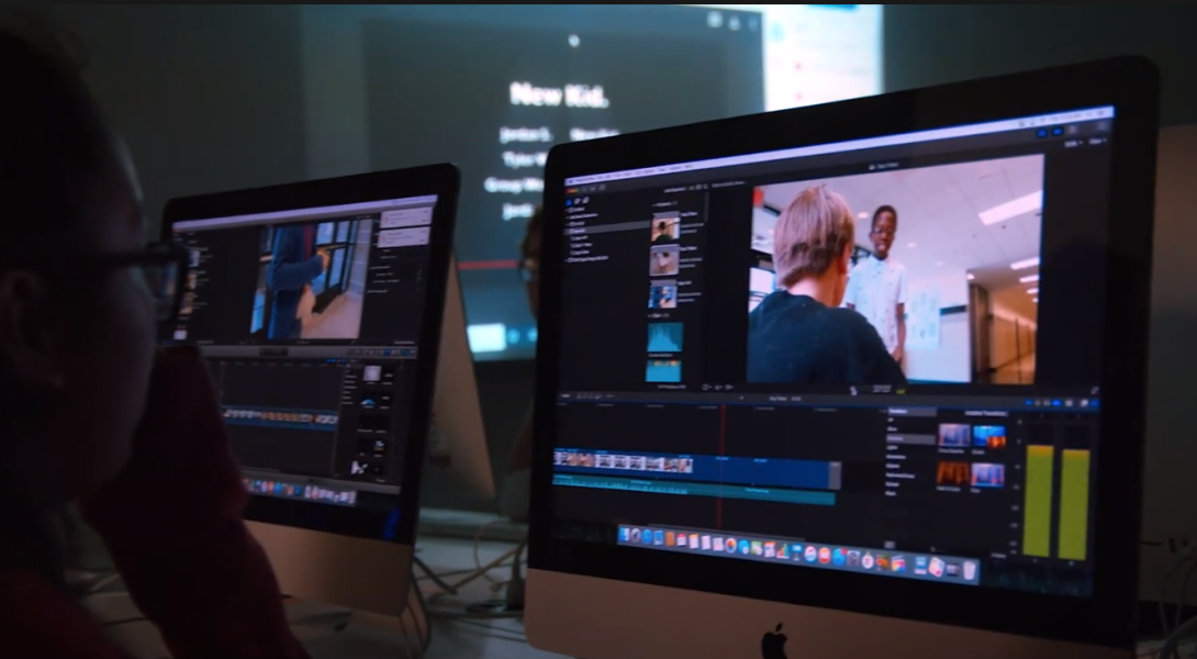 Computer screens showing student work