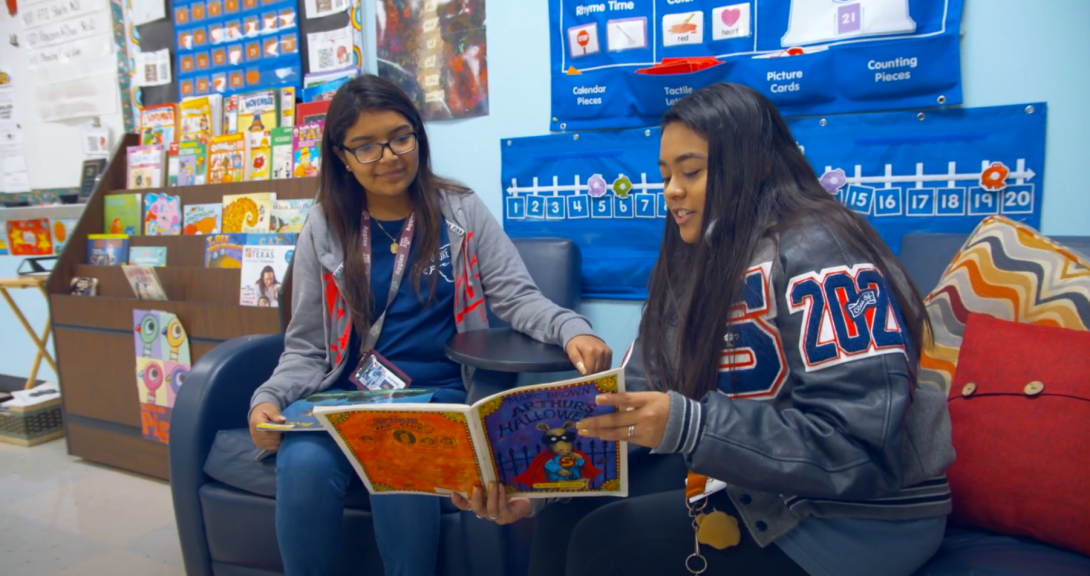 A student practicing giving a lesson to her teacher