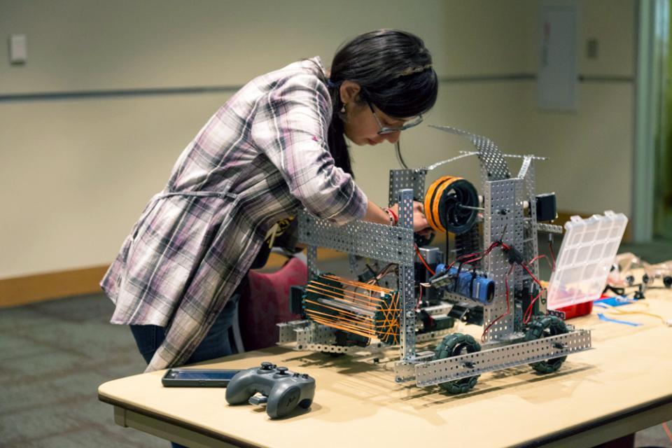 A student working on a robot