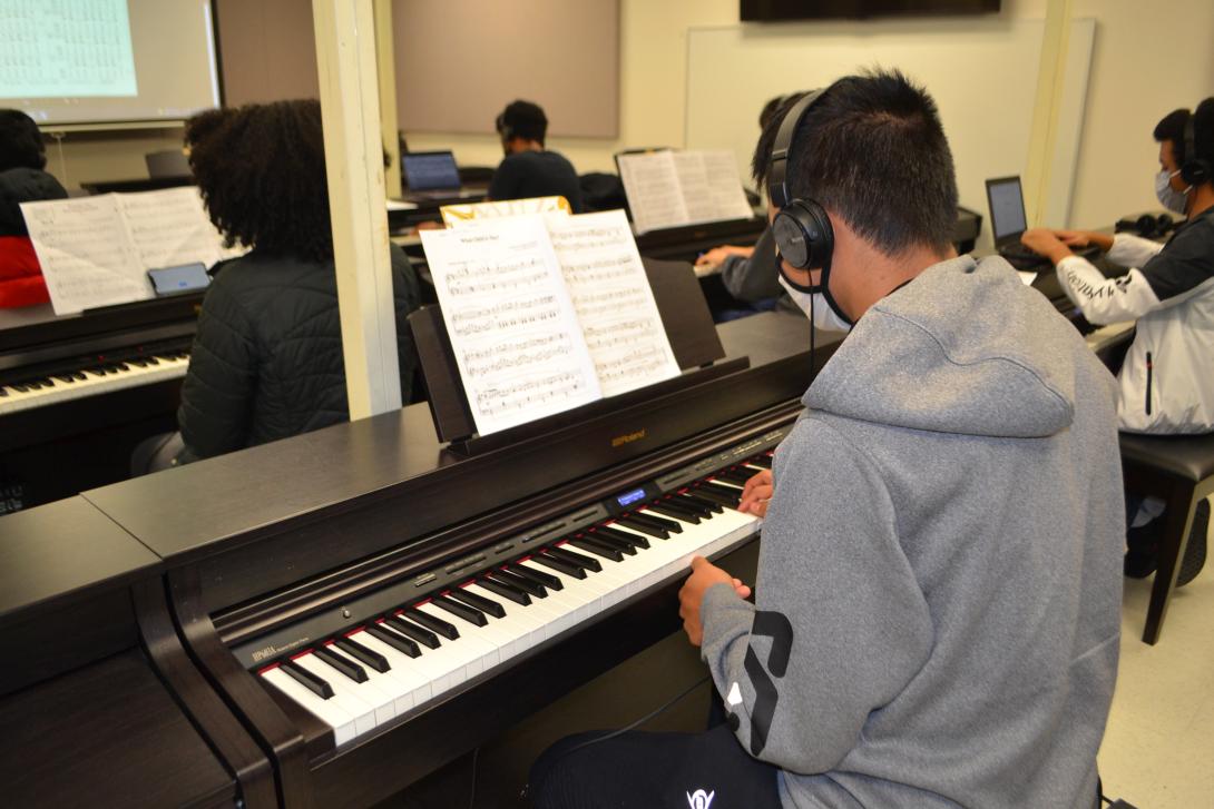 Student practicing piano