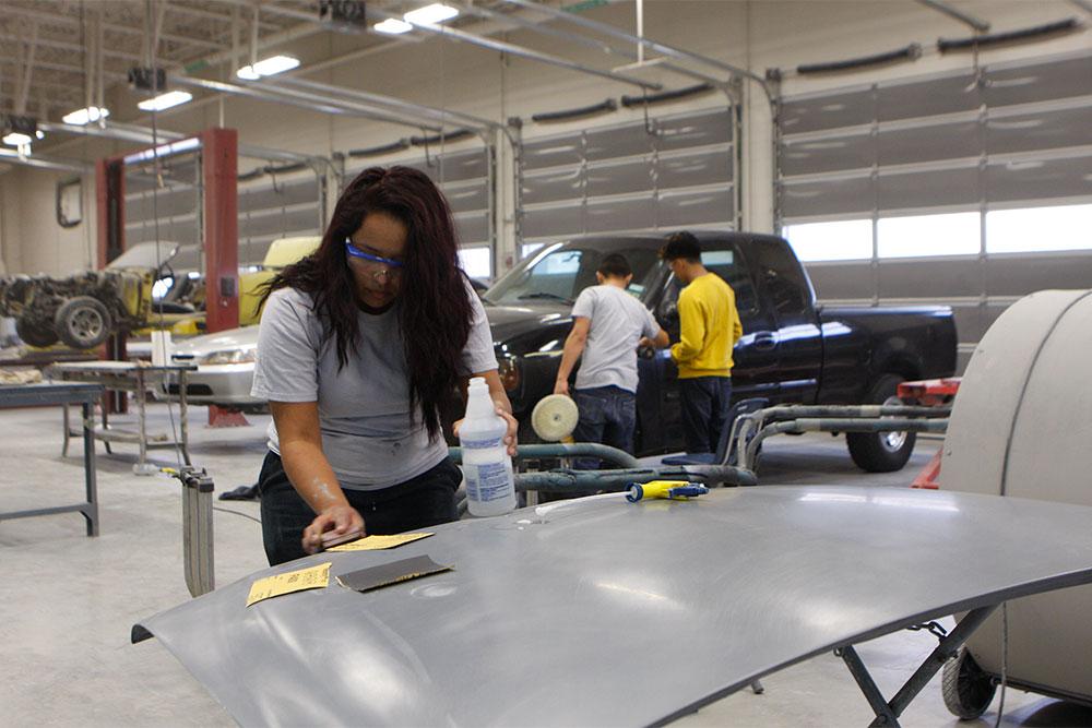 Students working in auto body shop at the Gilbreath-Reed Career and Technical Center.