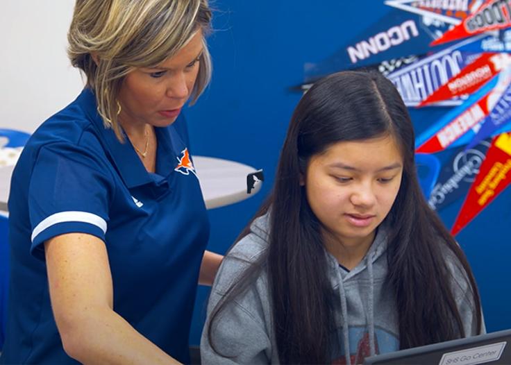 A counselor helping a student at the SHS GO Center