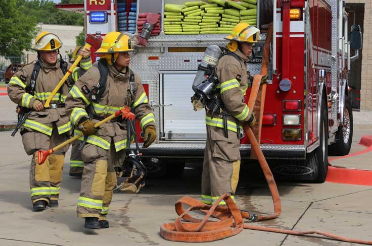 Students practicing firefighting drills at GRCTC