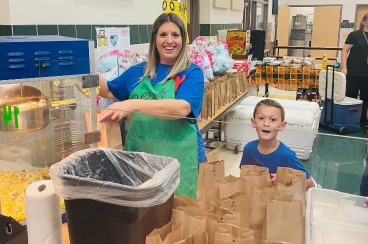 Parent volunteering with student