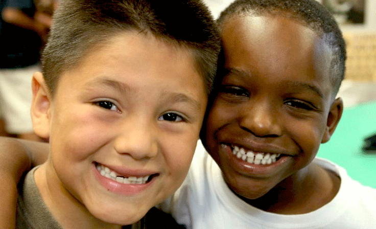 Two boys smiling for the camera