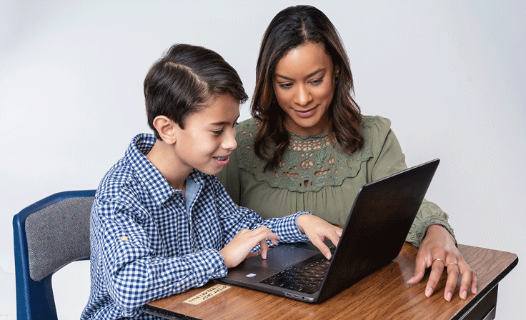 A parent and student on a laptop