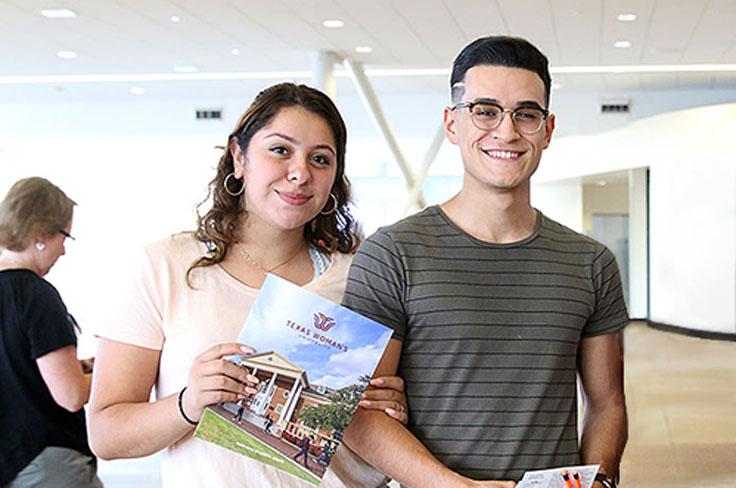 Students holding college folders