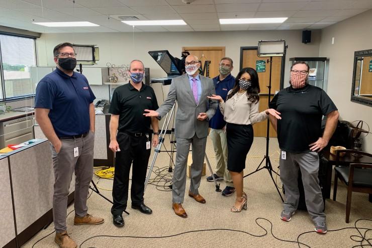 GRS-TV staff posing with superintendent