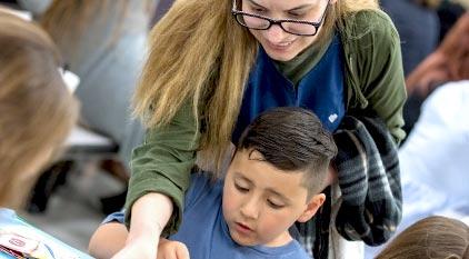 A parent helping her student use manipulatives at a Dyslexia event.