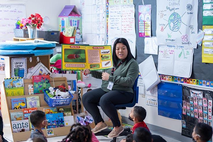 A teacher reading to a prekindergarten class.