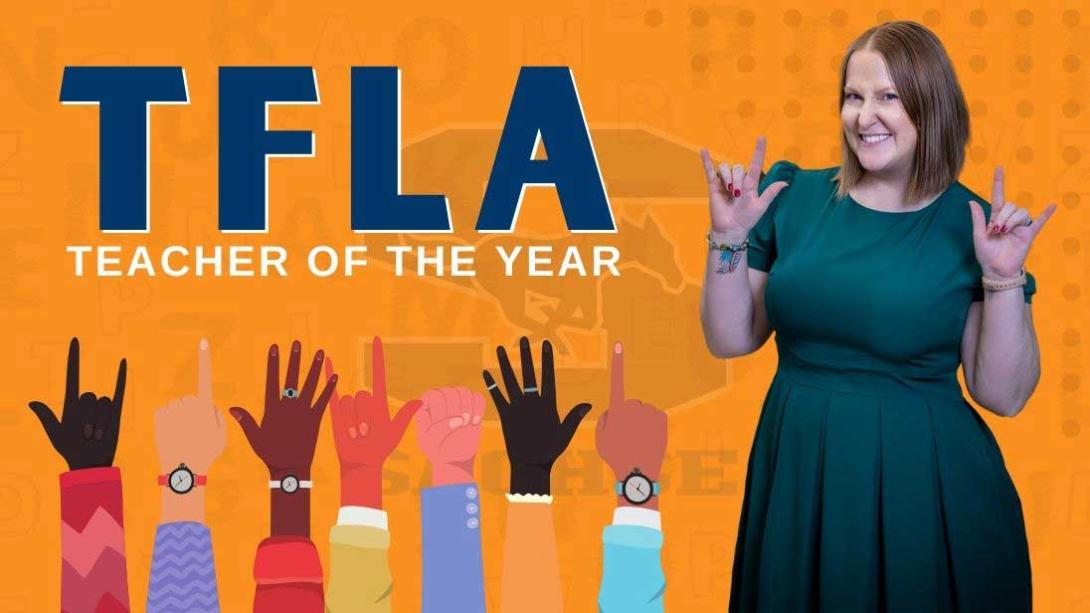 ASL Teacher of the year in a green dress standing next to text that reads T.F.L.A. - Teacher of the Year