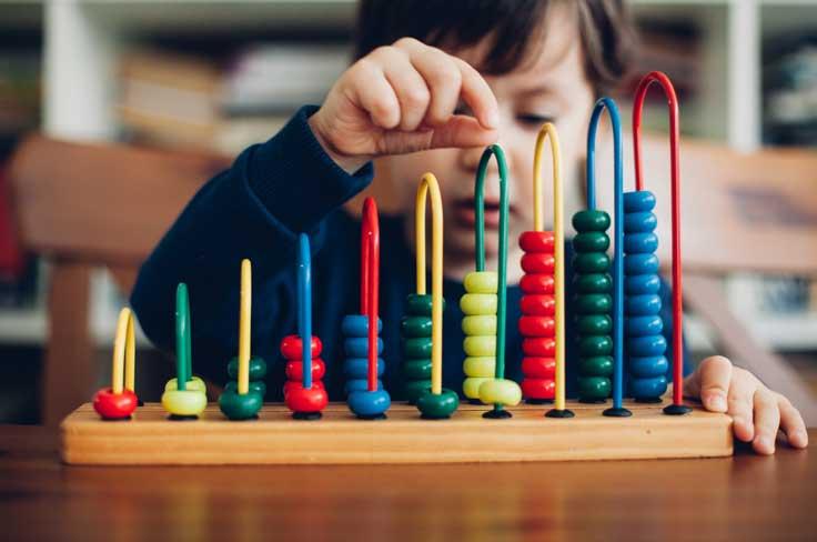 Young boy with abacus