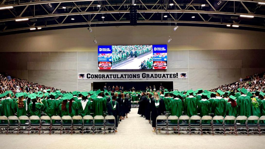 Class of 2023 standing in front of the graduation stage ready to walk in their ceremony