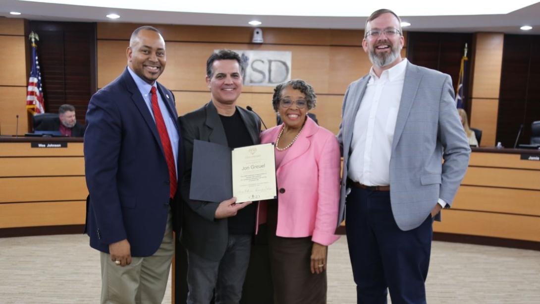Board presents the Garland ISD' Going the Extra Mile' award to Jon Greuel, a remarkable welding instructor at South Garland High School.