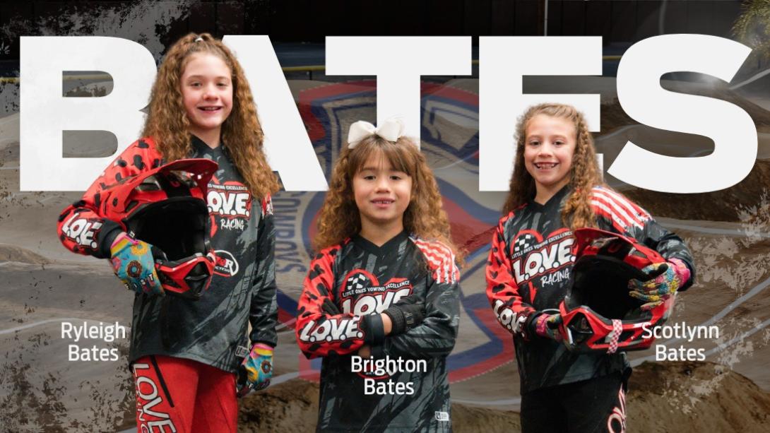 Bates Sisters stand in their BMX racing uniforms