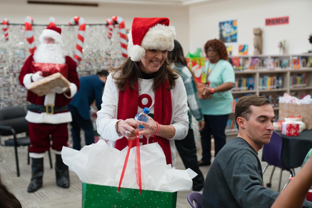 Adult woman holds gift bag