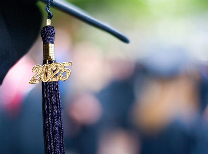 2025 tassel hangs off a graduation cap 