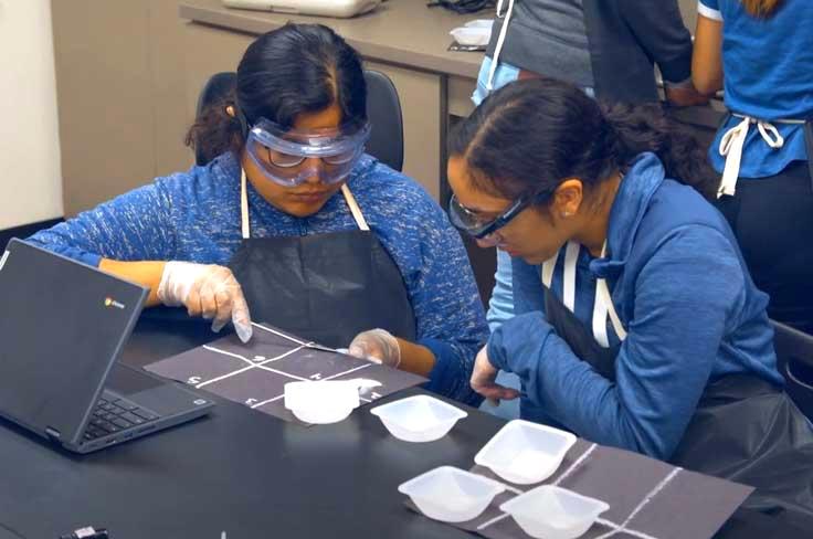 Girls in P-Tech magnet class wearing google while conducting science experiment