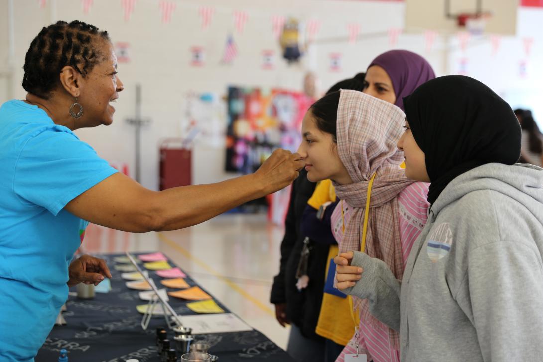 A female student smells an essential oil 