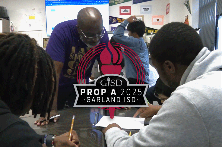 A teacher leans over a desk, helping a group of students. The GISD Prop A 2025 logo is overlaid on top.
