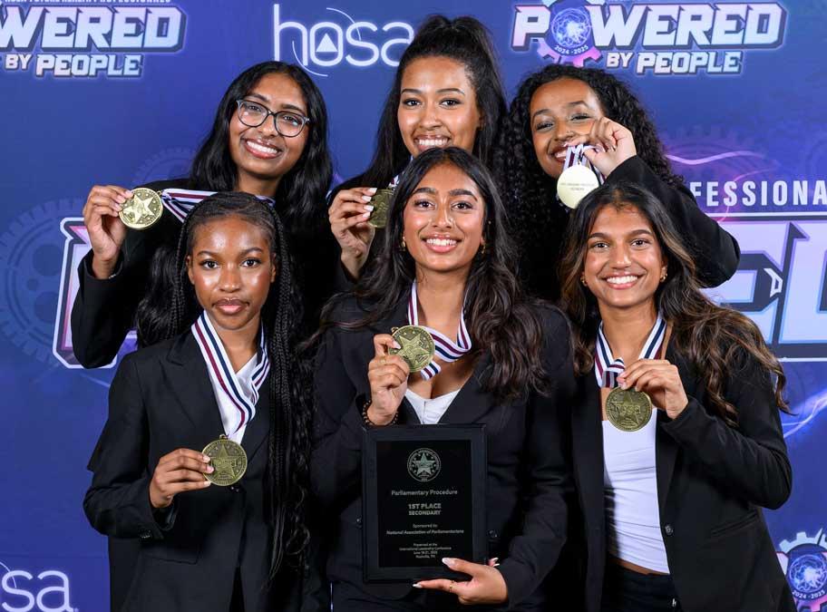 Award-winning HOSA team holding up medals