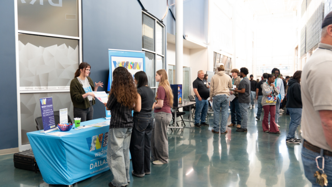 Students speak with prospective employers at a job fair