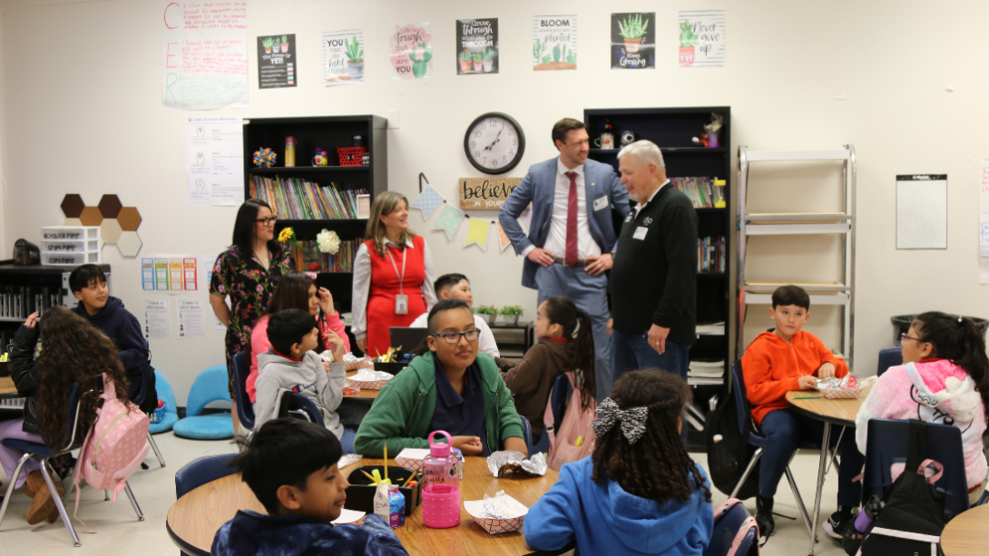 students enjoy breakfast in the classroom