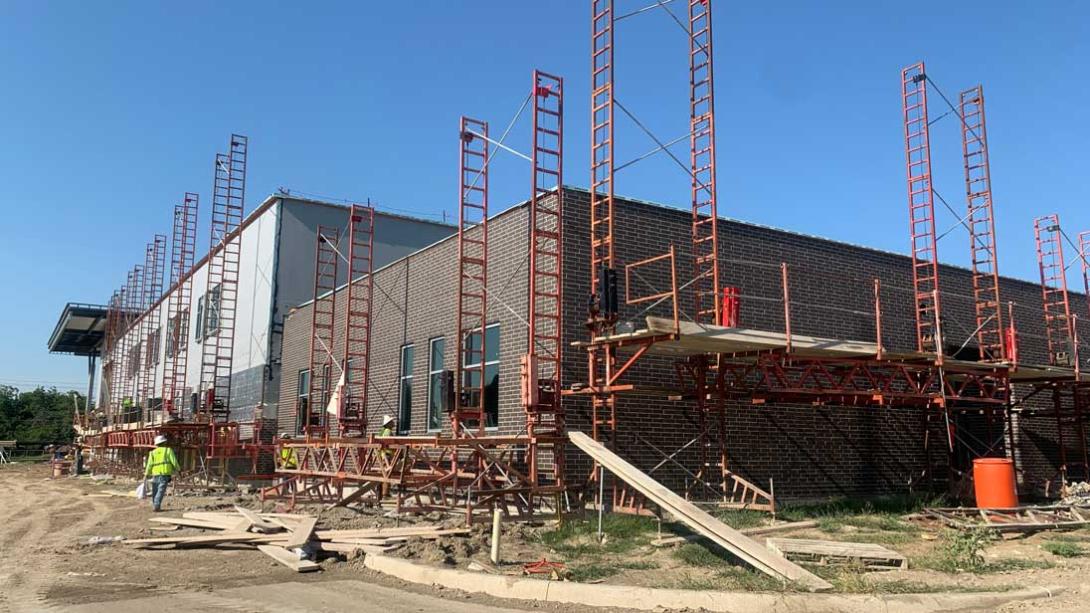 Exterior view showing brickwork in progress on Freeman Elementary